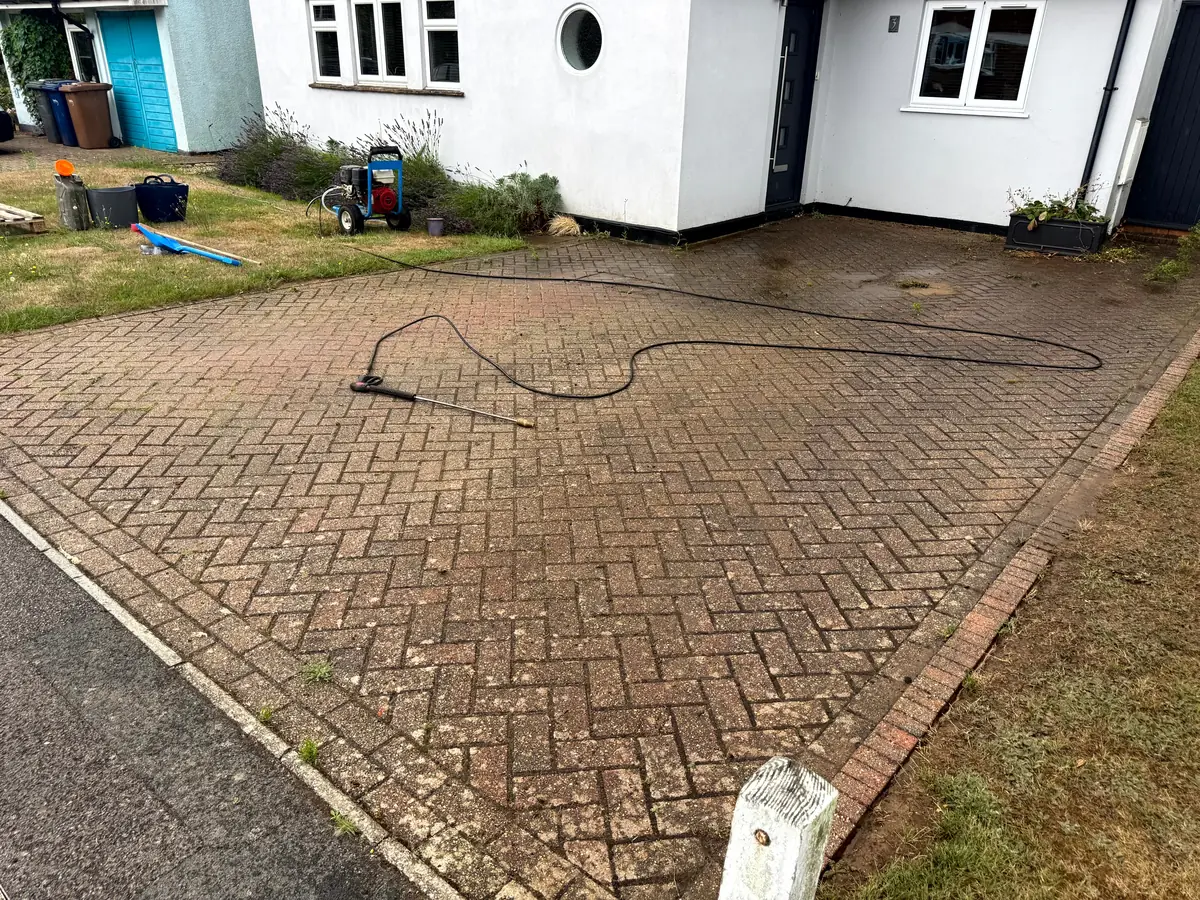 Dirty driveway in Godalming, Surrey before pressure washing