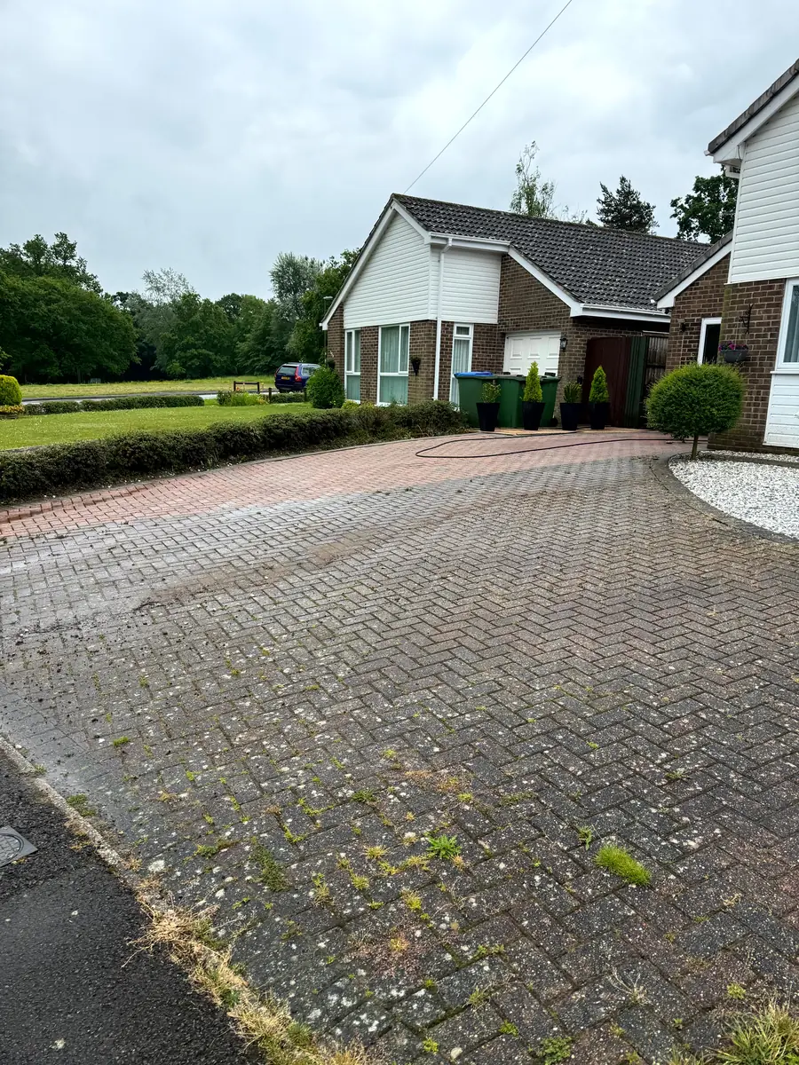 Dirty driveway in Horsham, West Sussex before pressure washing