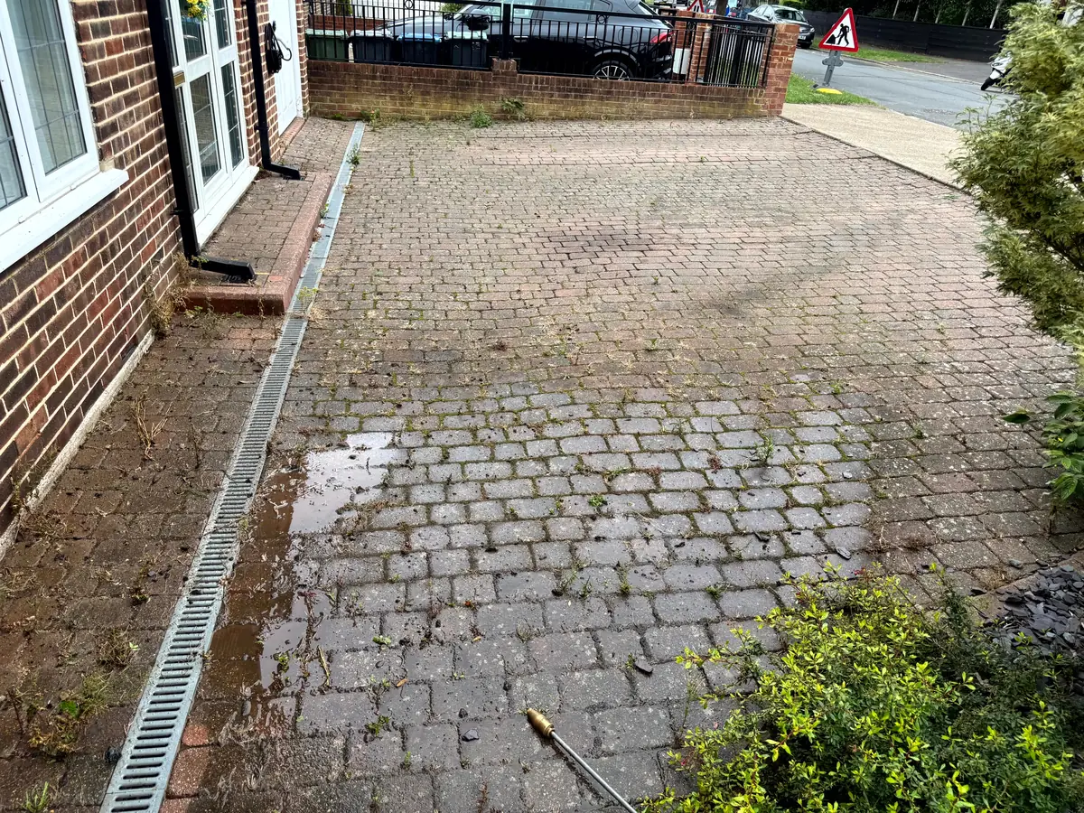 Dirty driveway in Kingston upon Thames, South West London before pressure washing